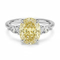 My Store 4 18K solid gold trilogy ring featuring a fancy yellow pear-cut lab-grown diamond with side stones