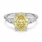 My Store 4 18K solid gold trilogy ring featuring a fancy yellow pear-cut lab-grown diamond with side stones