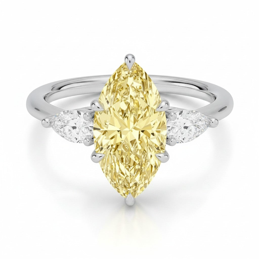 My Store 4 18K solid gold trilogy ring featuring a pear-cut fancy yellow diamond flanked by two smaller pear diamonds.