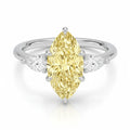 My Store 4 18K solid gold trilogy ring featuring a pear-cut fancy yellow diamond flanked by two smaller pear diamonds.
