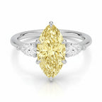 My Store 4 18K solid gold trilogy ring featuring a pear-cut fancy yellow diamond flanked by two smaller pear diamonds.