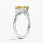 My Store 4 18K solid gold trilogy ring featuring a pear-cut fancy yellow lab-grown diamond and side stones.
