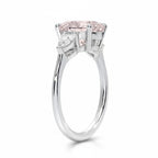 My Store 4 18K solid gold trilogy ring featuring a pear-cut fancy pink lab diamond with side stones, side profile view.