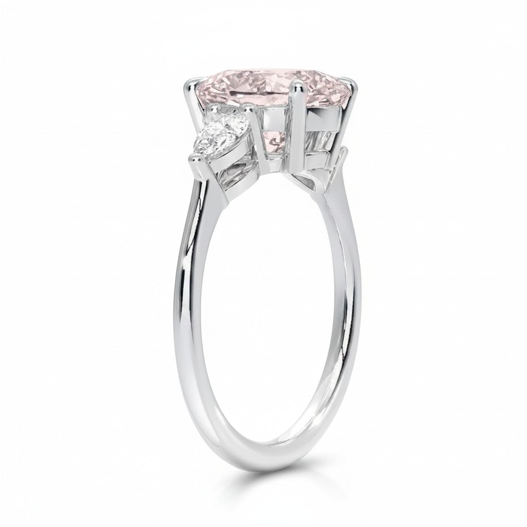 My Store 4 18K solid gold trilogy ring featuring a pear-cut fancy pink lab diamond with side stones, side profile view.