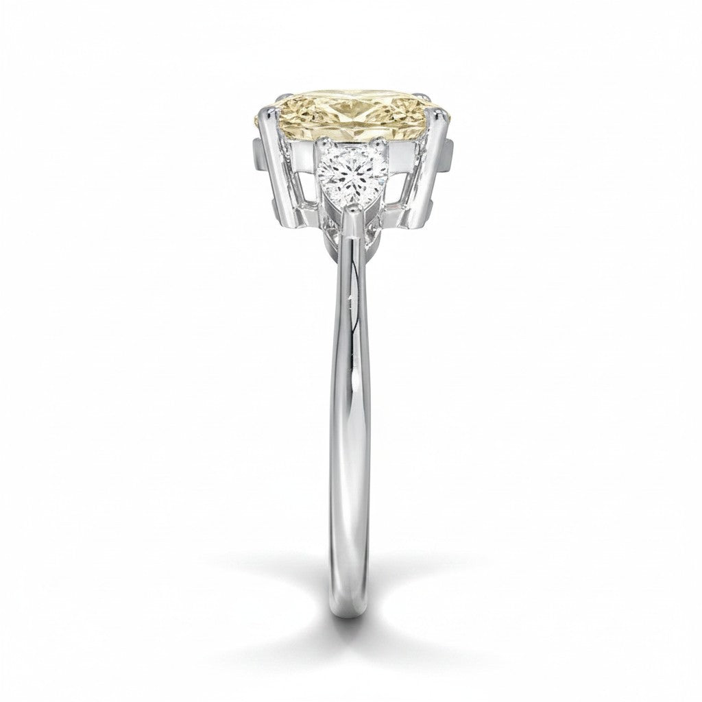 My Store 4 18K solid gold trilogy ring featuring a fancy color pear-cut lab-grown diamond and side stones