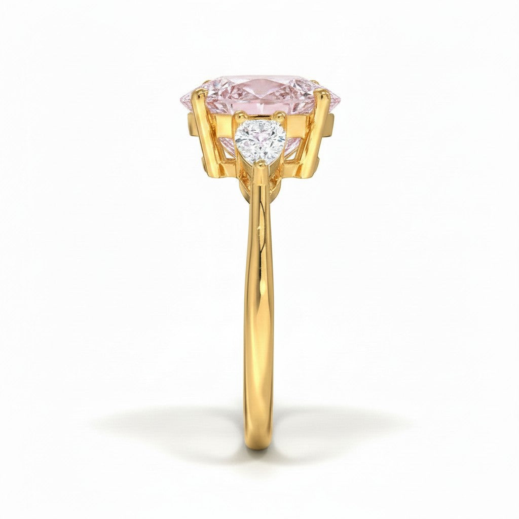 My Store 4 18K solid gold trilogy engagement ring with a pear-cut lab-grown diamond centerpiece and side stones.