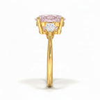 My Store 4 18K solid gold trilogy engagement ring with a pear-cut lab-grown diamond centerpiece and side stones.