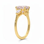 My Store 4 18K solid gold trilogy ring featuring a pear-cut fancy color lab diamond in a classic three-stone setting.