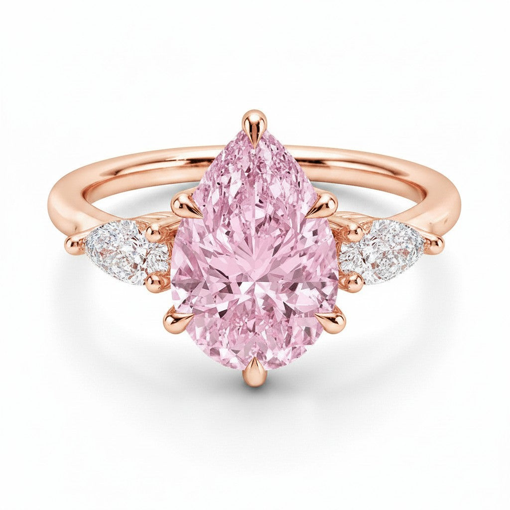 My Store 4 18K solid gold ring featuring a pear-cut pink fancy color diamond with heart-shaped side diamonds