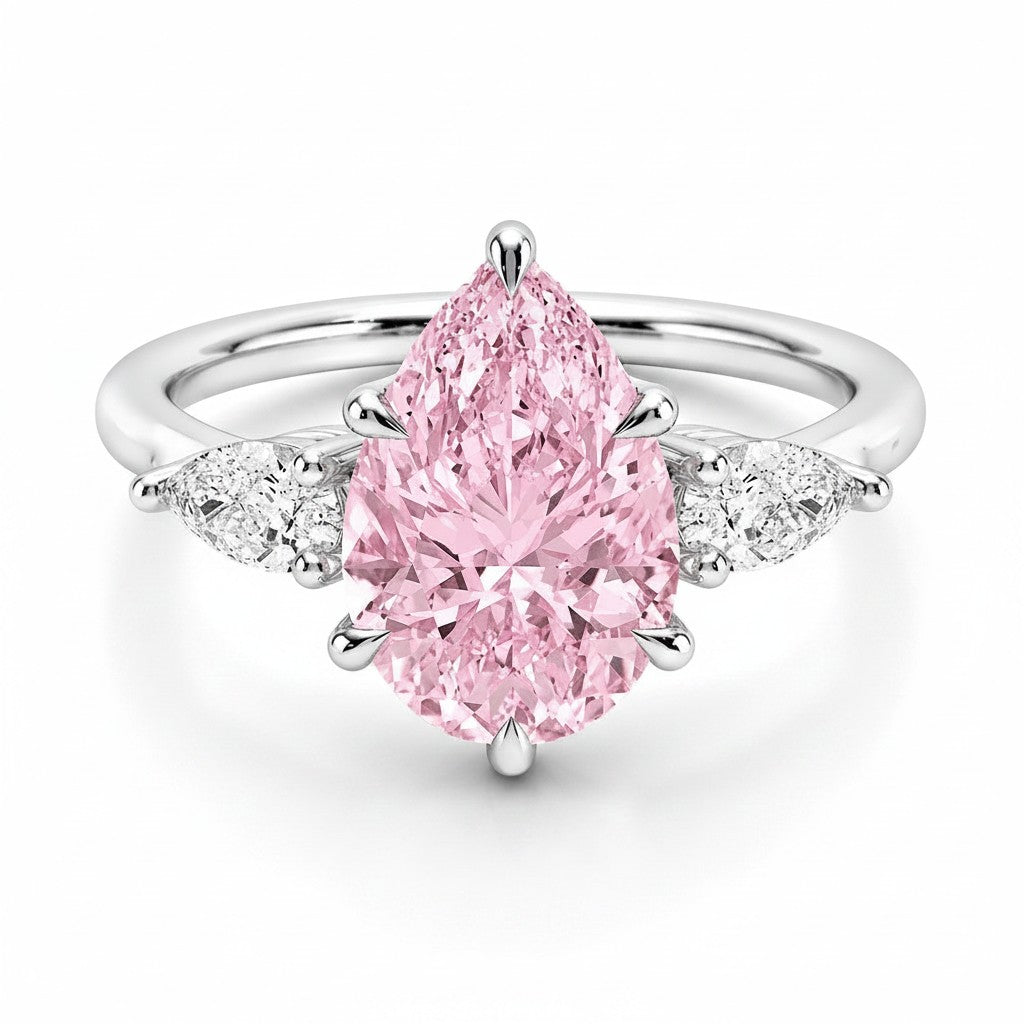 My Store 4 18K solid gold ring featuring a pear-cut pink fancy color diamond with sparkling side accent diamonds.