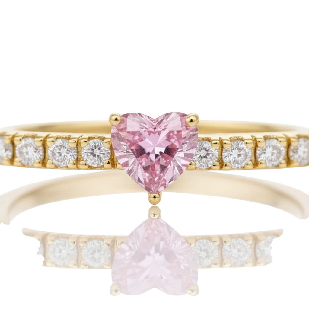 My Store 4 gold tennis bracelet featuring a central pink heart-cut diamond flanked by round brilliant white diamonds.