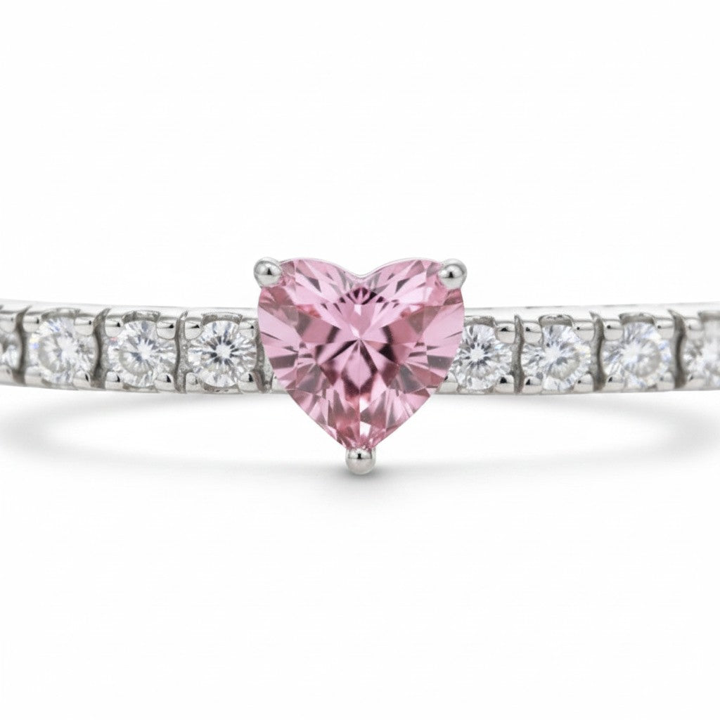 My Store 4 tennis bracelet featuring a fancy pink heart-cut diamond station set between round white diamonds in gold.