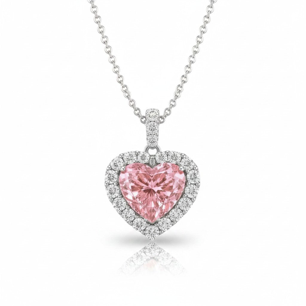 My Store 4 fancy pink heart-cut diamond pendant necklace with a white diamond halo set in 18K white gold on a chain.
