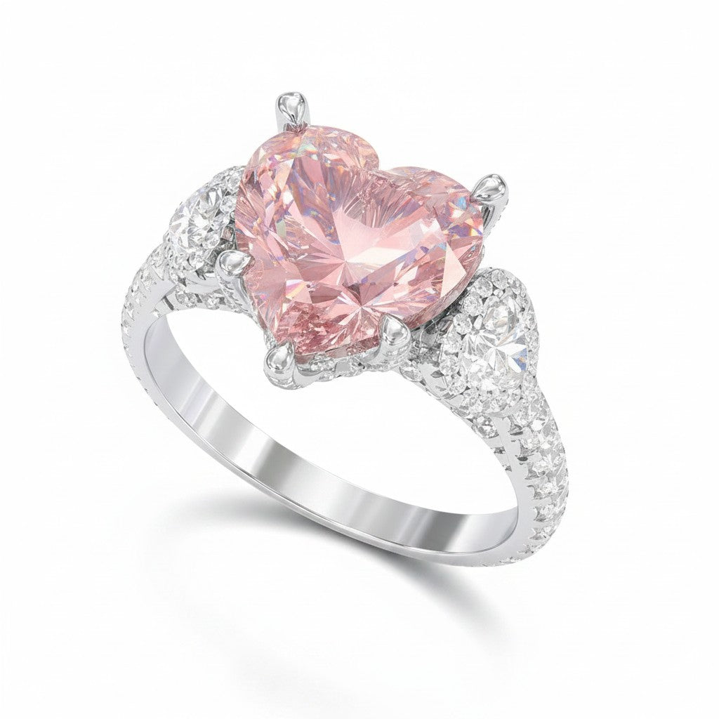 My Store 4 18K solid gold trilogy ring featuring a pink heart-cut lab-grown diamond with side accent diamonds.