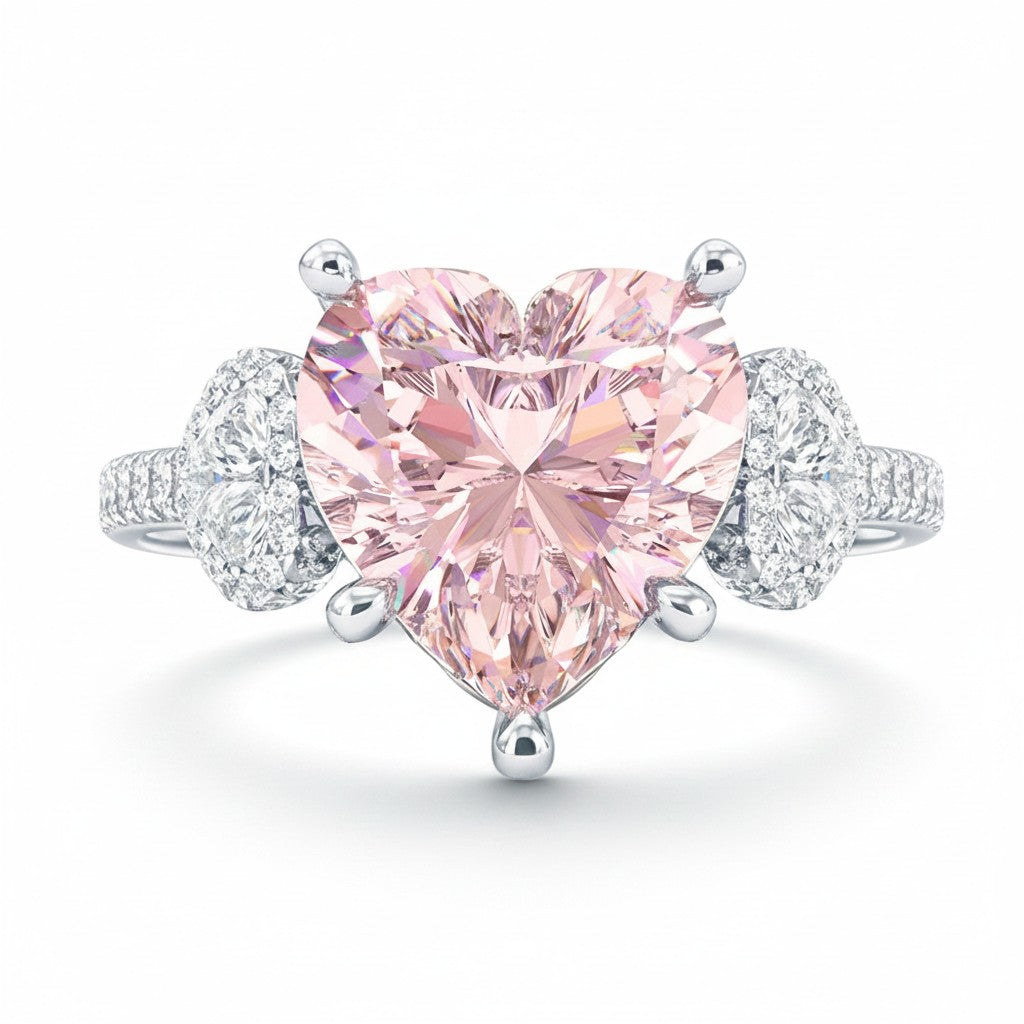 My Store 4 18K solid gold trilogy ring featuring a pink heart-cut lab-grown diamond with side diamond accents.