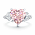 My Store 4 18K solid gold trilogy ring featuring a pink heart-cut lab-grown diamond with side diamond accents.