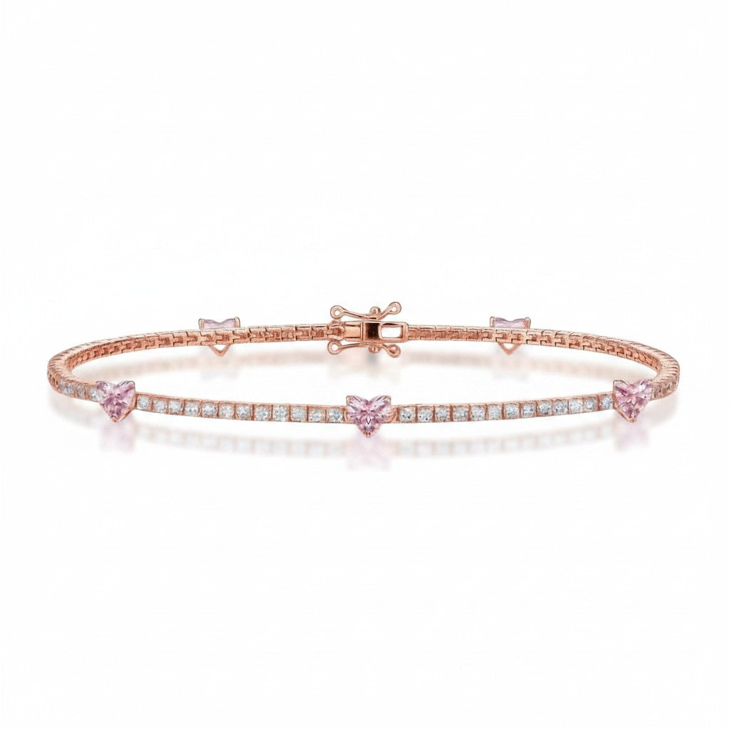 My Store 4 tennis bracelet in rose gold featuring round white diamonds and fancy pink heart-cut diamond stations.