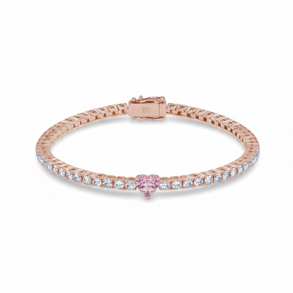 My Store 4 tennis bracelet in rose gold with a central pink heart-cut diamond and round white diamond accents.