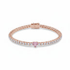 My Store 4 tennis bracelet in rose gold with a central pink heart-cut diamond and round white diamond accents.
