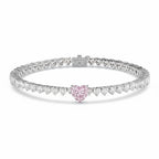 My Store 4 tennis bracelet featuring a central pink heart-cut diamond surrounded by white heart-cut diamonds in gold.