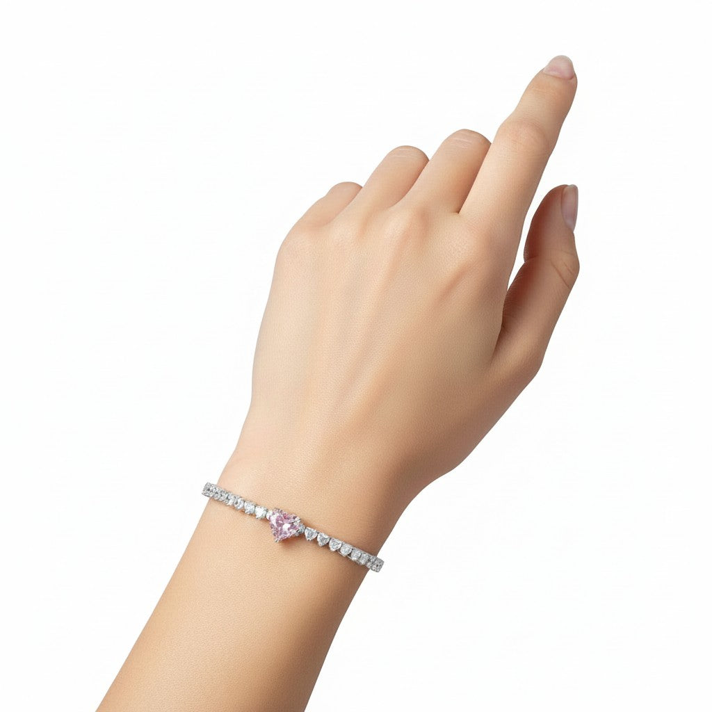 My Store 4 tennis bracelet featuring a central pink heart-cut diamond surrounded by white heart-cut diamonds on a wrist