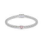 My Store 4 tennis bracelet featuring a central pink heart-cut diamond surrounded by round white diamonds in gold