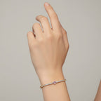 My Store 4 tennis bracelet featuring a central pink heart-cut diamond surrounded by round white diamonds in gold