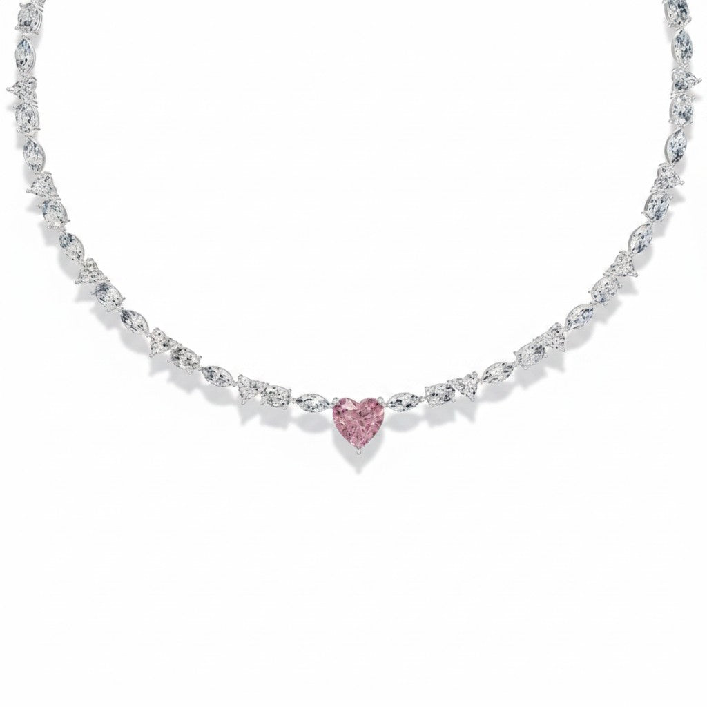 My Store 4 tennis necklace featuring a central pink heart-cut diamond with alternating marquise and round white stones.