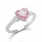 My Store 4 18K solid gold trilogy ring featuring a pink heart-cut lab-grown diamond and round side stones.