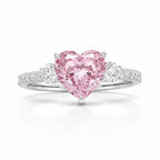 My Store 4 18K solid gold trilogy ring featuring a pink heart-cut lab-grown diamond with round side stones.