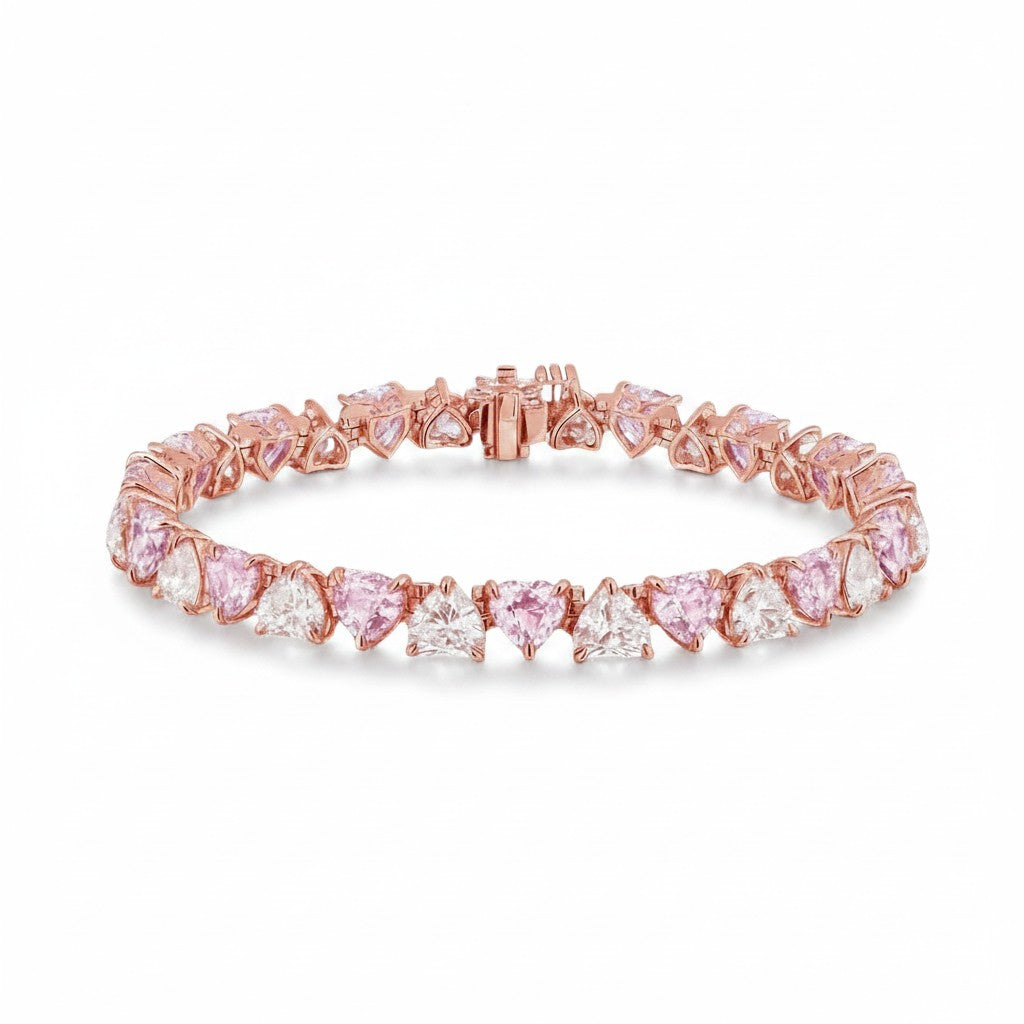 My Store 4 tennis bracelet featuring alternating fancy pink and white heart-cut diamonds set in rose gold.