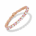 My Store 4 tennis bracelet featuring alternating fancy pink and white heart-cut diamonds set in rose gold links.