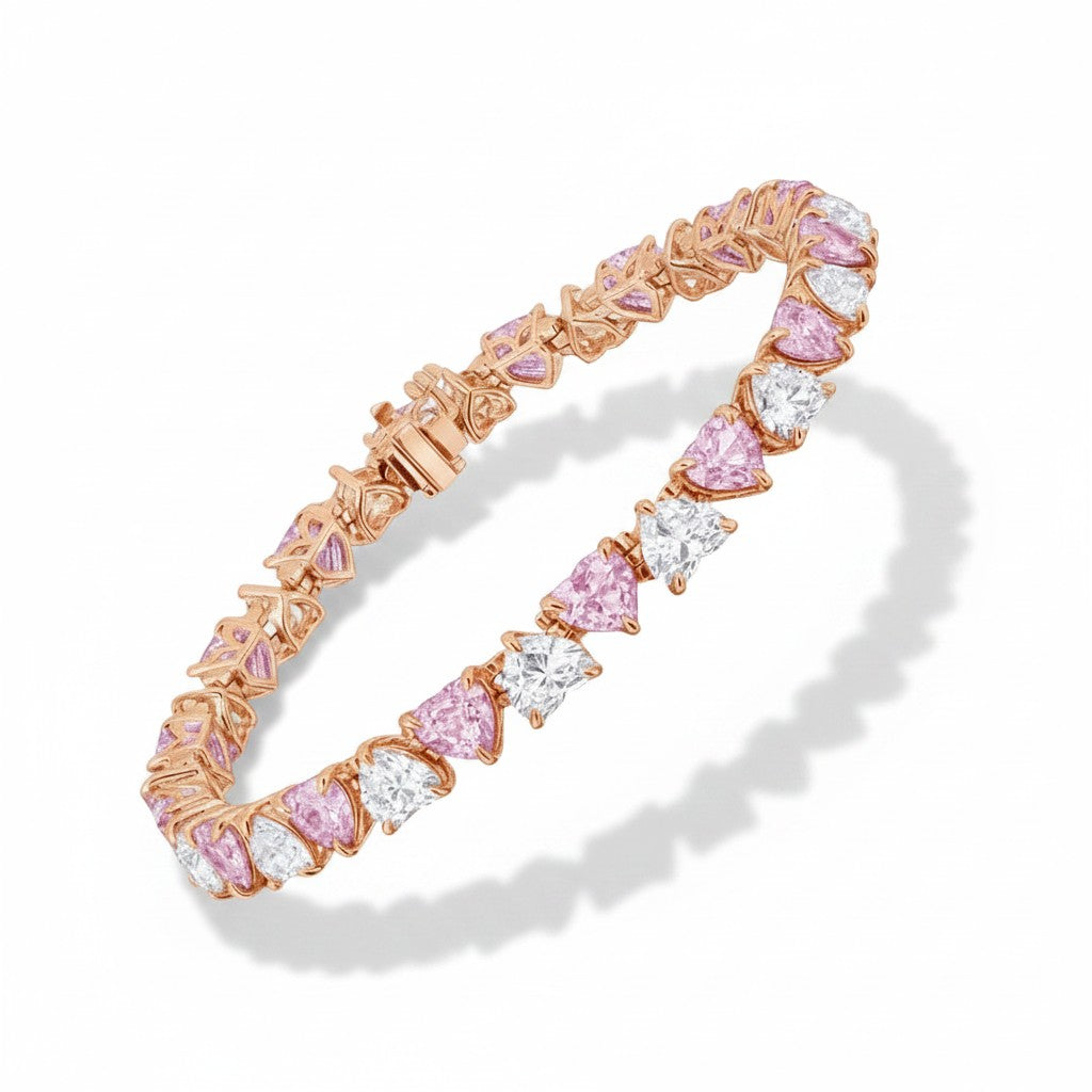 My Store 4 tennis bracelet featuring alternating fancy pink and white heart-cut diamonds set in rose gold links.