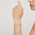 My Store 4 tennis bracelet featuring alternating fancy pink and white heart-cut diamonds in solid gold 3-prong settings.