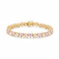 My Store 4 tennis bracelet featuring alternating pink and white heart-cut diamonds in gold 3-prong settings.