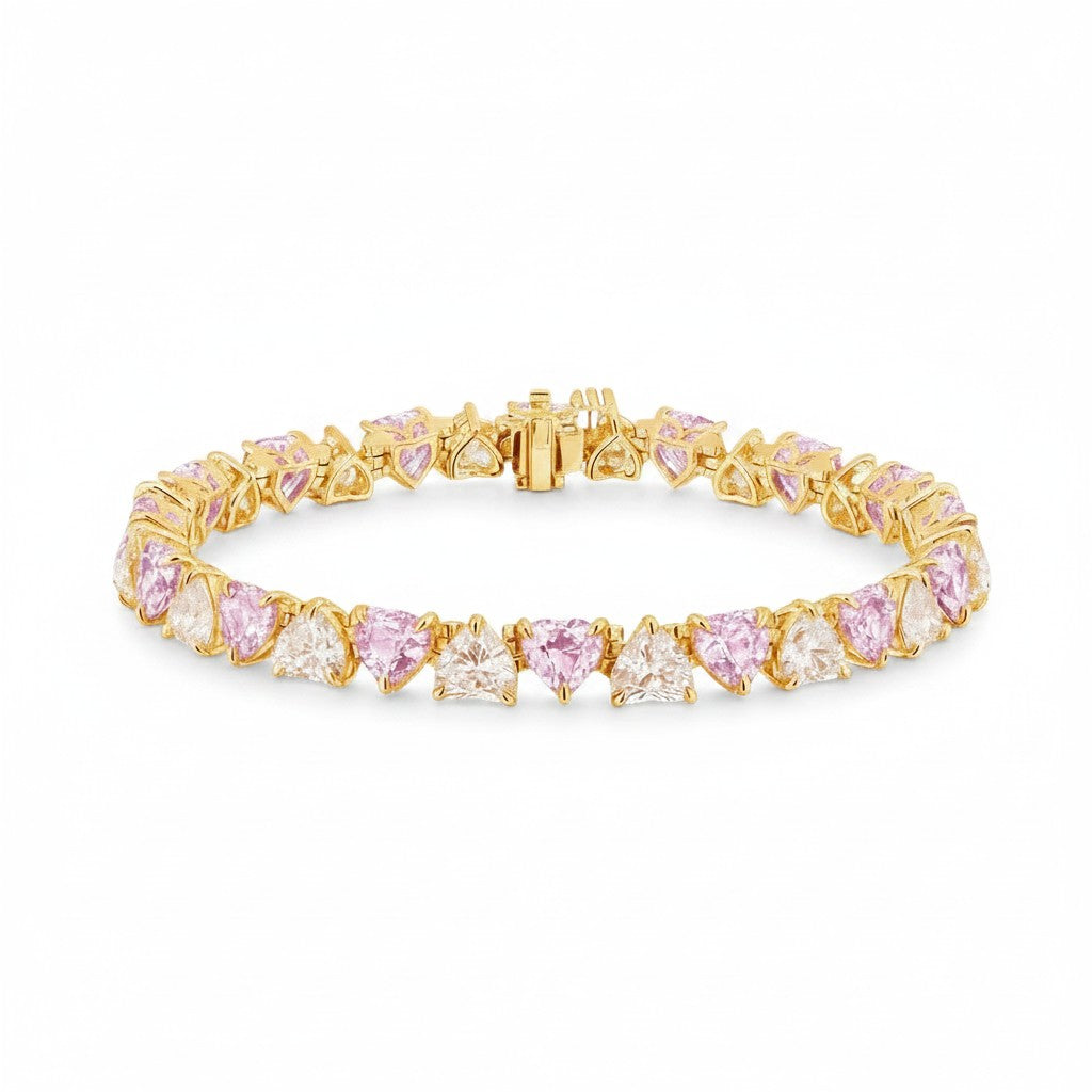 My Store 4 tennis bracelet featuring alternating pink and white heart-cut diamonds in gold 3-prong settings.