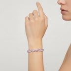 My Store 4 tennis bracelet featuring alternating fancy pink and white heart-cut diamonds in a solid gold setting.