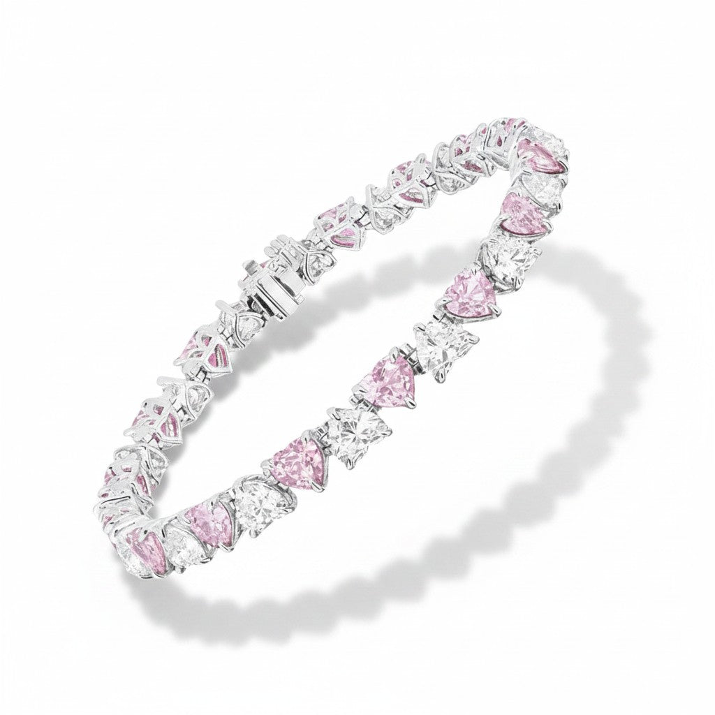 My Store 4 tennis bracelet with alternating fancy pink and white heart-cut diamonds in solid gold 3-prong settings.