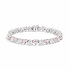 My Store 4 tennis bracelet featuring alternating fancy pink and white heart-cut diamonds in a solid gold setting.