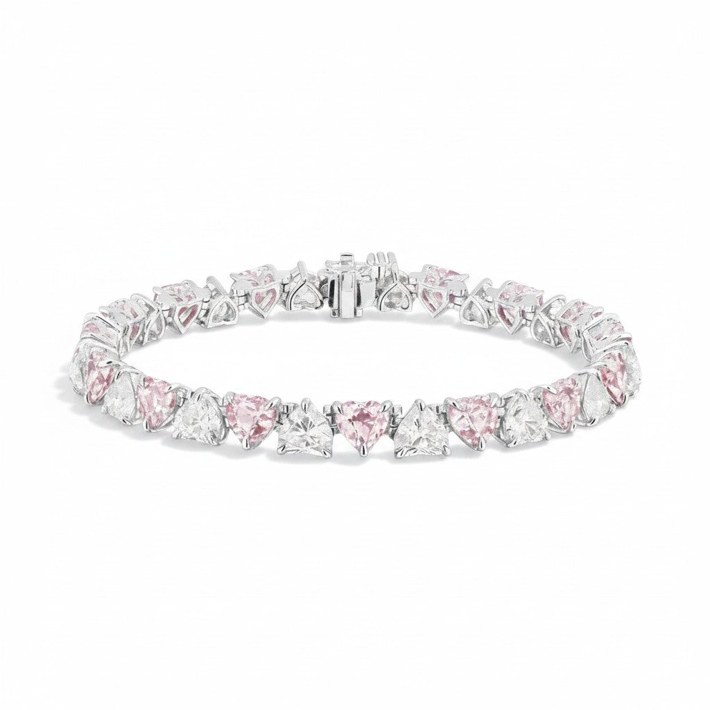 My Store 4 tennis bracelet featuring alternating fancy pink and white heart-cut diamonds in a solid gold setting.