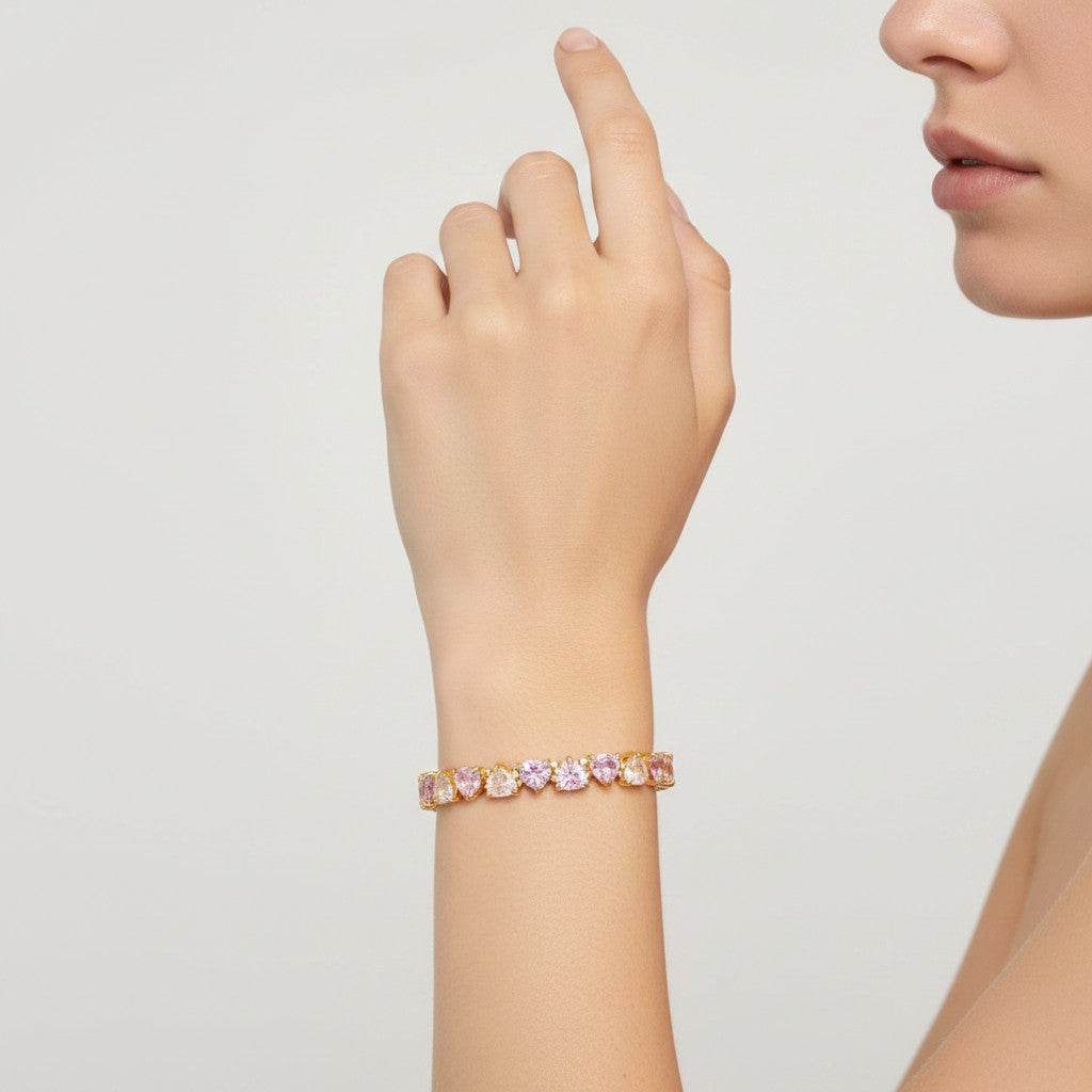 My Store 4 tennis bracelet featuring alternating fancy pink and white heart-cut diamonds set in gold on a wrist