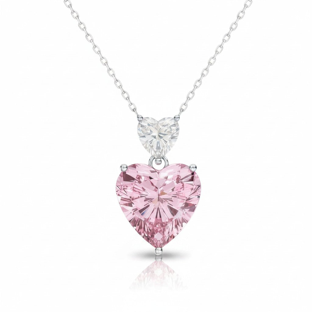 My Store 4 Toi et Moi pendant necklace featuring a white heart diamond above a large fancy pink heart diamond in gold.