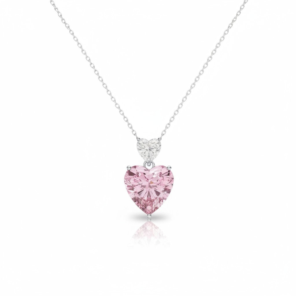 My Store 4 Toi et Moi pendant necklace featuring a white heart diamond above a large fancy pink heart diamond in gold.