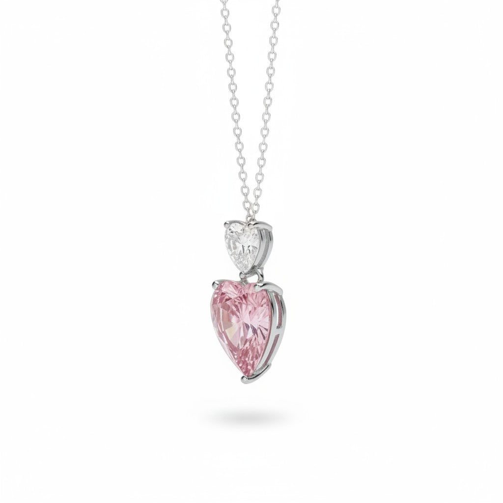My Store 4 Toi et Moi pendant necklace featuring a white heart diamond above a large fancy pink heart diamond in gold.