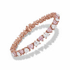 My Store 4 tennis bracelet featuring alternating pink and white heart-cut stones set in polished rose gold links.