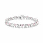My Store 4 tennis bracelet featuring alternating pink and white heart-cut stones set in polished gold.