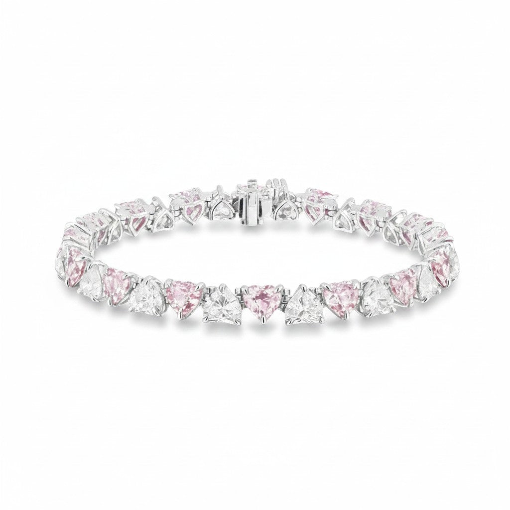 My Store 4 tennis bracelet featuring alternating pink and white heart-cut stones set in polished gold.