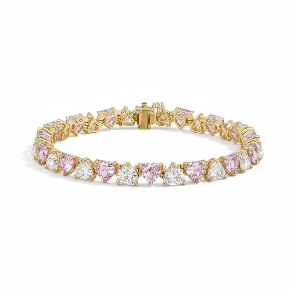 My Store 4 tennis bracelet featuring alternating pink and white heart-cut stones set in polished yellow gold.