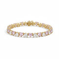 My Store 4 tennis bracelet featuring alternating pink and white heart-cut stones set in polished yellow gold.
