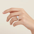 My Store 4 18K solid gold princess-cut lab diamond engagement ring set with a pavé band worn on a woman's finger.
